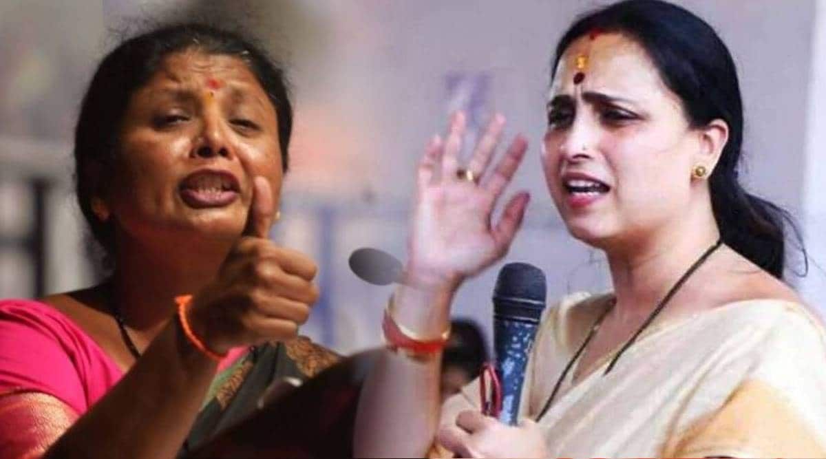 This image features two women in traditional Indian attire engaged in passionate speech or debate. The woman on the left, dressed in a saree with a red blouse, is raising her hand with an assertive expression. The woman on the right, also in a saree, is holding a microphone and gesturing with her hand while speaking. Their facial expressions and body language suggest strong emotions, possibly in a political or social discussion.