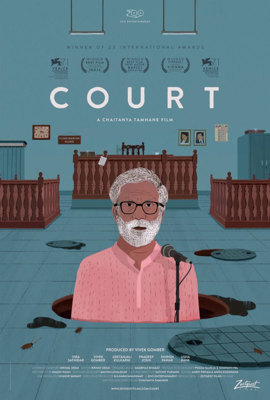 This is a movie poster for Court, a film directed by Chaitanya Tamhane. The poster features an illustration of an elderly man with glasses and a white beard, wearing a pink shirt, standing in a courtroom setting. He is speaking into a microphone while emerging from an open manhole, symbolizing the film's themes of systemic flaws and social injustice. The background depicts a typical Indian courtroom with wooden benches, a judge's podium, official portraits on the wall, and signs like "Please Maintain Silence." The presence of open manholes and cockroaches on the floor adds to the film's commentary on bureaucracy and oppression.